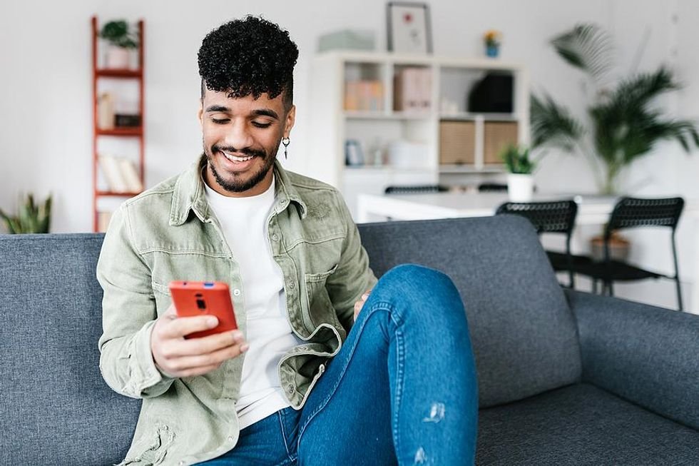 Man checks LinkedIn on his ​phone 